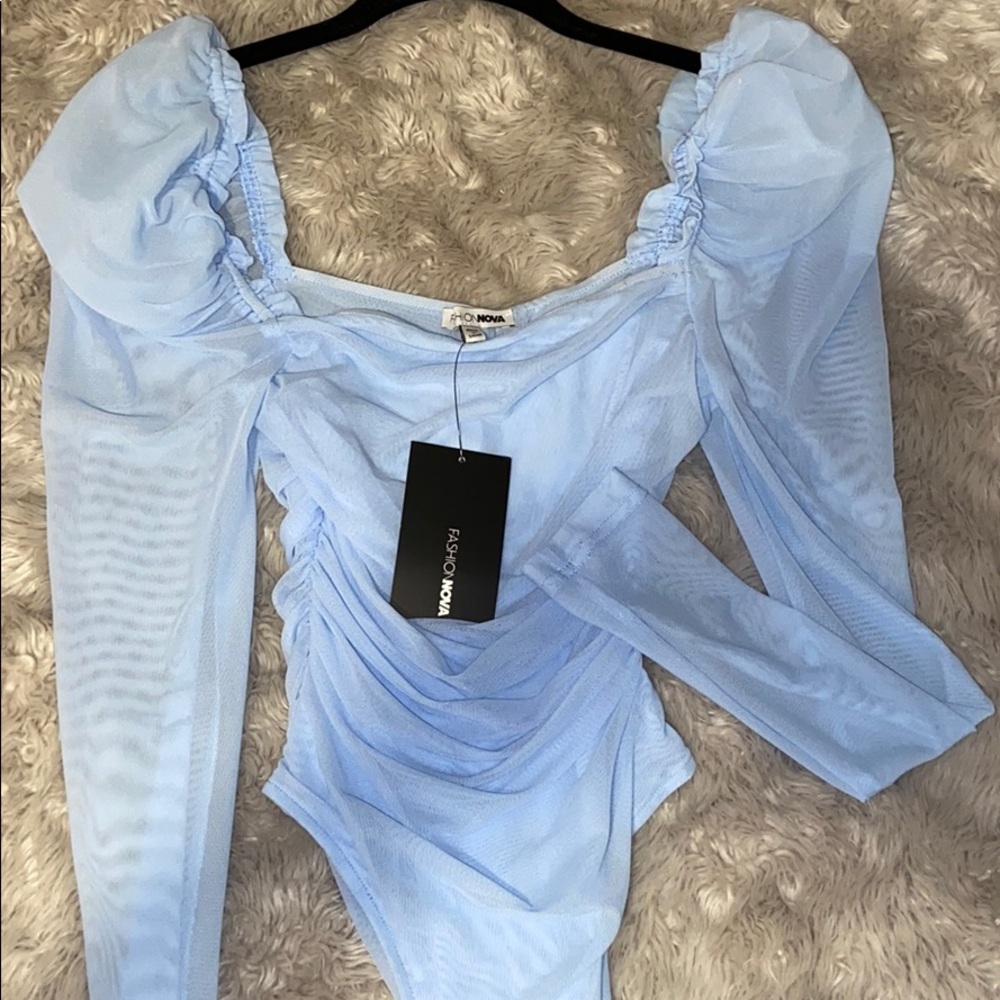 baby blue Fashion Nova Body suit.